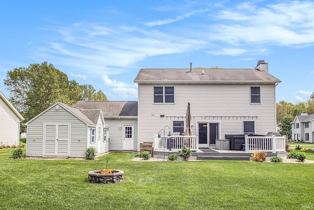54453 Sagewood Dr, Mishawaka, IN 46545 - rear view of house with an outdoor fire pit, a chimney, a wooden deck, and a yard