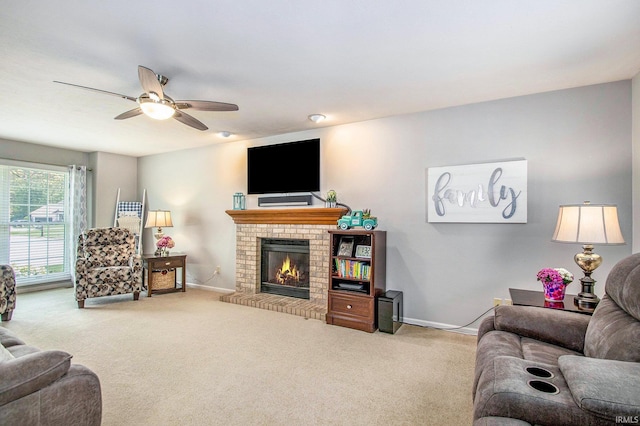 54453 Sagewood Dr, Mishawaka, IN 46545 - living room with carpet floors, ceiling fan, a brick fireplace, and baseboards