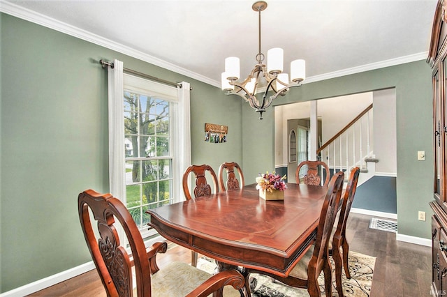 54453 Sagewood Dr, Mishawaka, IN 46545 - dining area featuring a chandelier, baseboards, stairway, ornamental molding, and dark wood-style floors