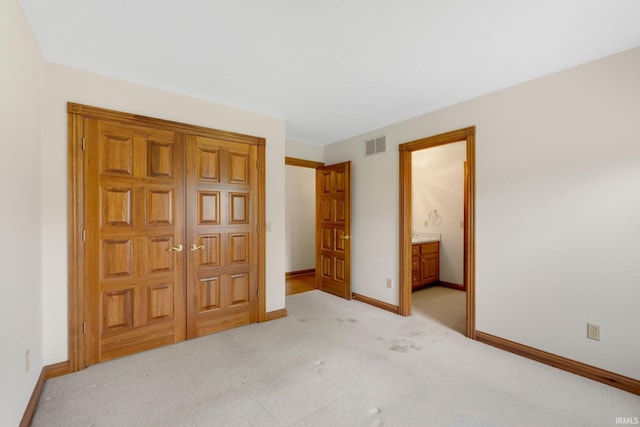 2519 Knightsbridge Dr, Fort Wayne, IN 46815 - unfurnished bedroom with baseboards, light colored carpet, and ensuite bathroom