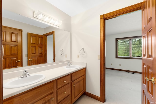 2519 Knightsbridge Dr, Fort Wayne, IN 46815 - bathroom with double vanity and baseboards