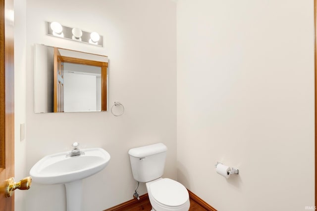 2519 Knightsbridge Dr, Fort Wayne, IN 46815 - half bathroom with toilet and wood finished floors