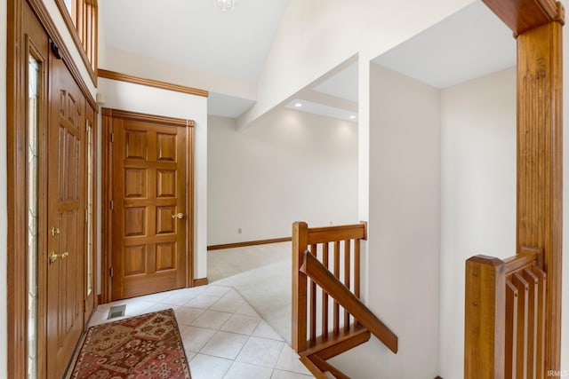 2519 Knightsbridge Dr, Fort Wayne, IN 46815 - entrance foyer featuring light tile patterned flooring, light carpet, and baseboards