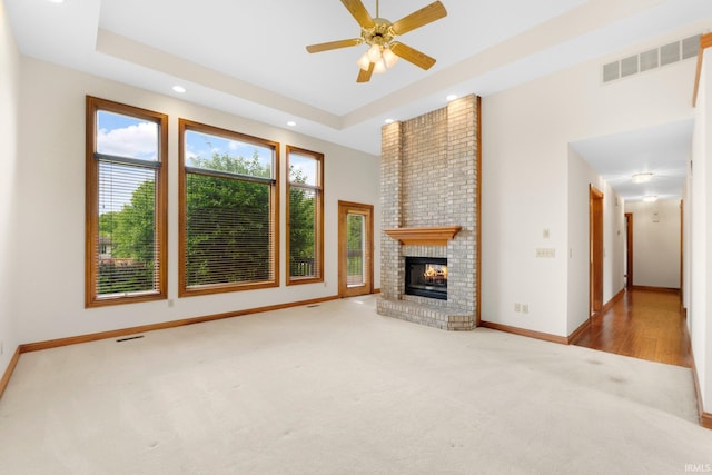 2519 Knightsbridge Dr, Fort Wayne, IN 46815 - unfurnished living room with carpet floors, a ceiling fan, a fireplace, baseboards, and recessed lighting