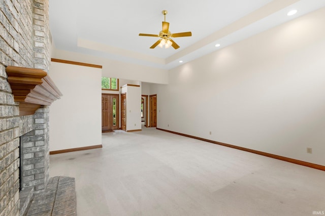 2519 Knightsbridge Dr, Fort Wayne, IN 46815 - unfurnished living room featuring a fireplace, light colored carpet, a ceiling fan, baseboards, and recessed lighting