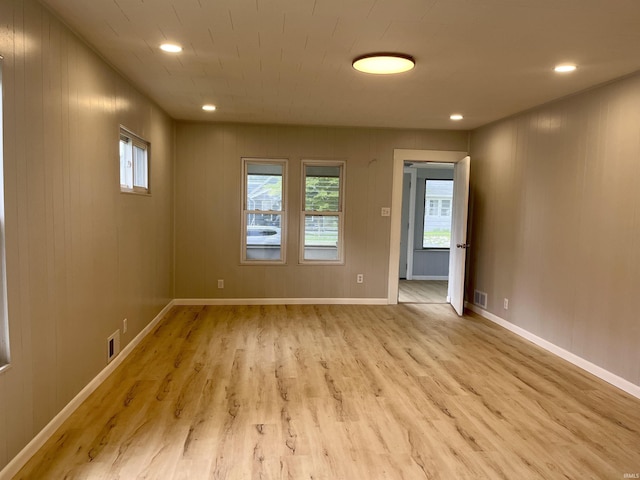 626 S 24th St, South Bend, IN 46615 - empty room featuring wood finished floors, plenty of natural light, baseboards, and recessed lighting