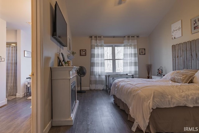 853 S 400 E Rd, Marion, IN 46953 - bedroom featuring wood finished floors, baseboards, and a fireplace