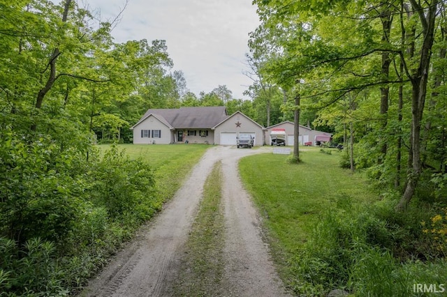 853 S 400 E Rd, Marion, IN 46953 - ranch-style home with dirt driveway, a front yard, and a garage