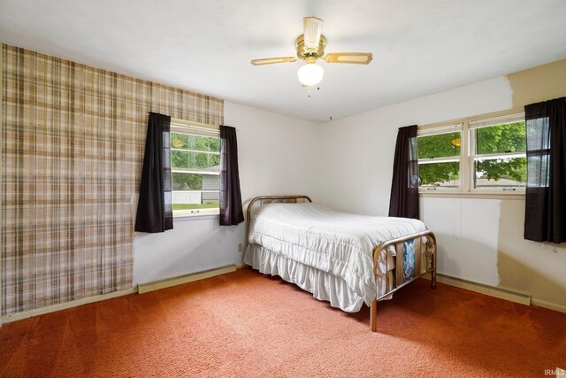213 S Clark St, Auburn, IN 46706 - carpeted bedroom featuring a baseboard radiator, baseboards, and ceiling fan