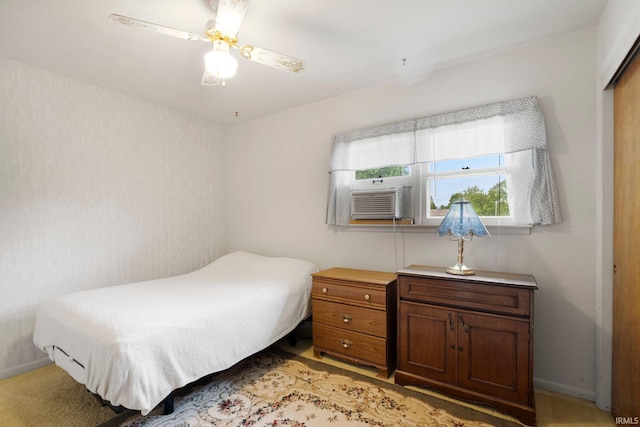 213 S Clark St, Auburn, IN 46706 - bedroom with cooling unit, a closet, a ceiling fan, baseboards, and light colored carpet