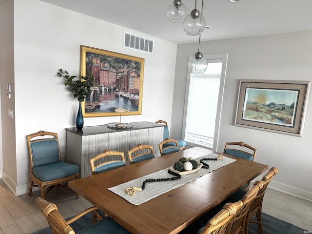 6138 E Elwood St, Syracuse, IN 46567 - dining area featuring baseboards and wood finished floors