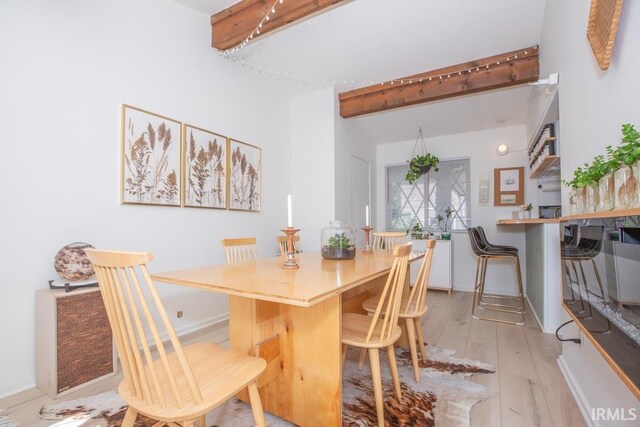 7300 E Blackford Ave, Evansville, IN 47715 - dining space featuring beamed ceiling, light wood-style flooring, and baseboards