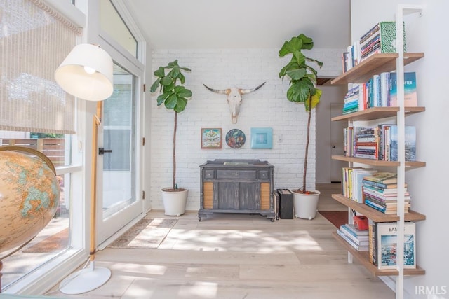 7300 E Blackford Ave, Evansville, IN 47715 - living area featuring wood finished floors and brick wall