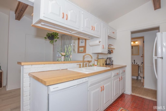 7300 E Blackford Ave, Evansville, IN 47715 - kitchen with white appliances, a sink, white cabinetry, a peninsula, and brick patterned floors