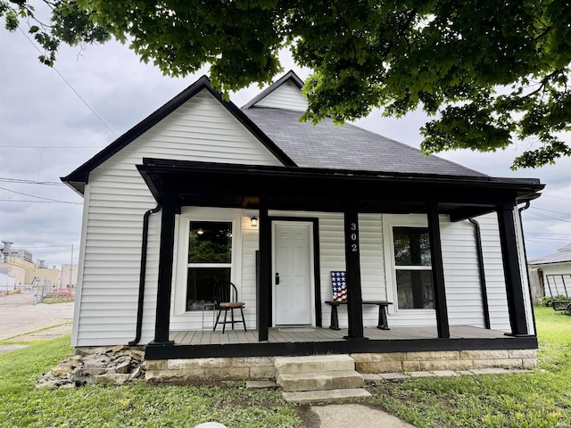 302 L St, Bedford, IN 47421 - view of front of property featuring covered porch and a shingled roof