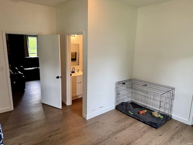 302 L St, Bedford, IN 47421 - bedroom featuring wood finished floors, baseboards, and a sink