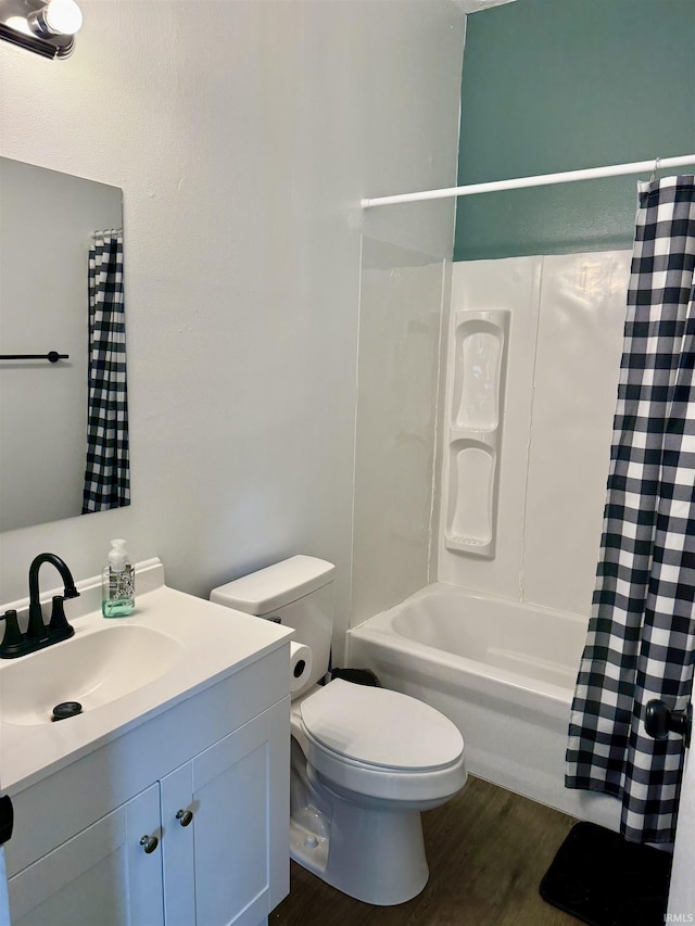 302 L St, Bedford, IN 47421 - full bathroom featuring vanity, toilet, shower / bath combo with shower curtain, and wood finished floors