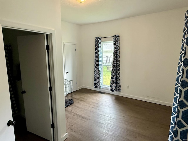 302 L St, Bedford, IN 47421 - unfurnished room featuring wood finished floors and baseboards