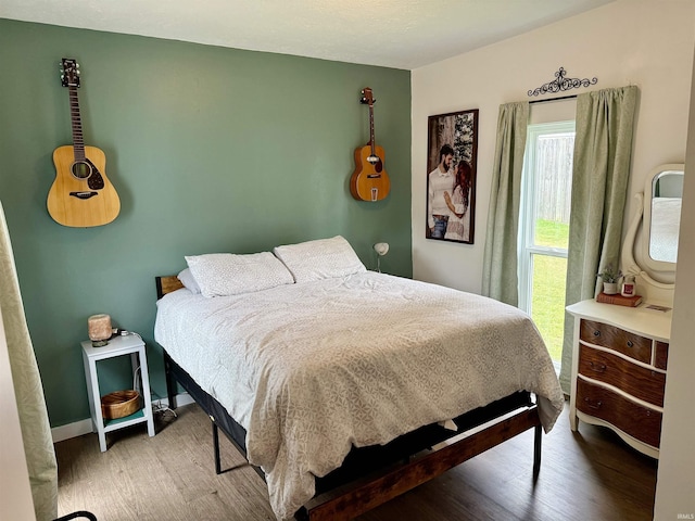 302 L St, Bedford, IN 47421 - bedroom featuring wood finished floors and baseboards