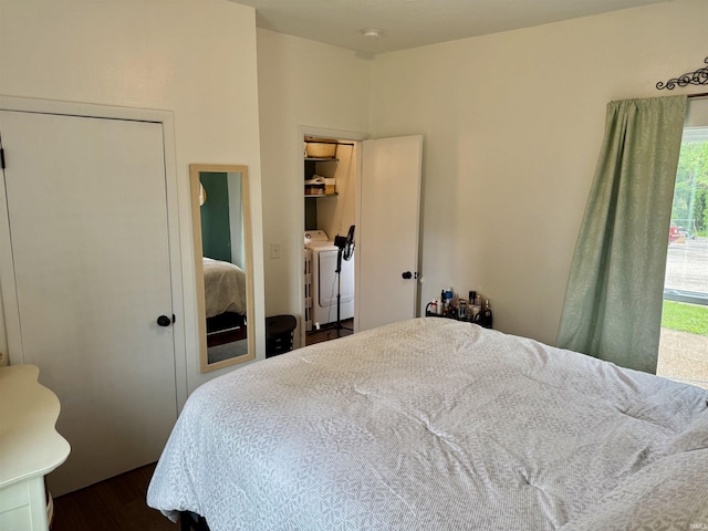 302 L St, Bedford, IN 47421 - bedroom with washing machine and clothes dryer and dark wood-style flooring