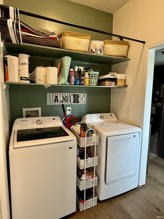 302 L St, Bedford, IN 47421 - laundry area featuring washing machine and dryer and wood finished floors