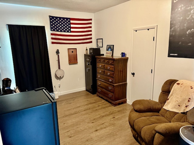 302 L St, Bedford, IN 47421 - living area with light wood-type flooring and baseboards