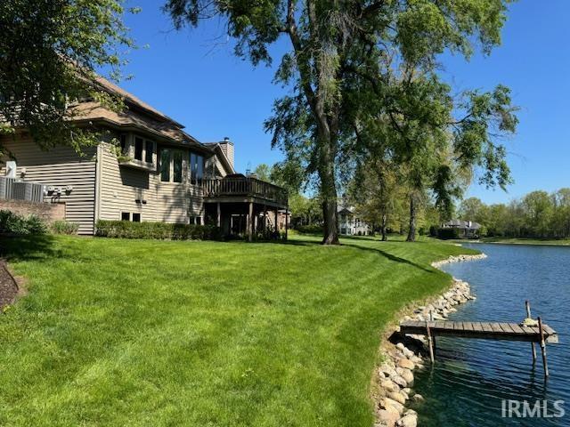 2525 Ladue Cv, Fort Wayne, IN 46804 - view of grassy yard with a water view and a boat dock