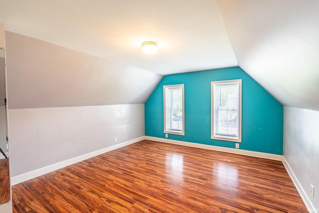 139 Elm St, Wabash, IN 46992 - additional living space with wood finished floors, vaulted ceiling, and baseboards
