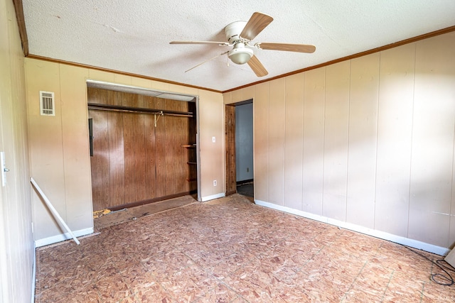 139 Elm St, Wabash, IN 46992 - unfurnished bedroom with ornamental molding, a textured ceiling, a closet, and a ceiling fan
