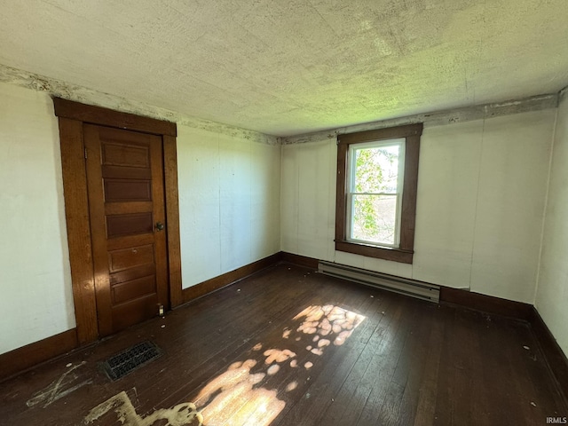 8595 W 1000 S Unit 35, Lafontaine, IN 46940 - spare room with a baseboard radiator, dark wood finished floors, and baseboards