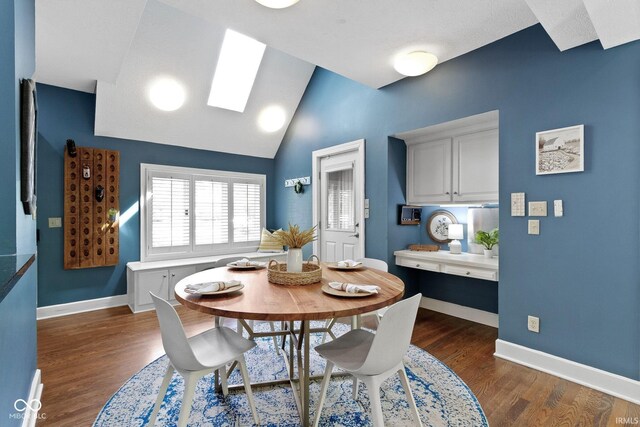 10919 Running Tide Ct, Indianapolis, IN 46236 - dining area with baseboards, dark wood-type flooring, vaulted ceiling, and a skylight