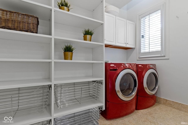 10919 Running Tide Ct, Indianapolis, IN 46236 - laundry area featuring cabinet space, independent washer and dryer, light tile patterned floors, and baseboards