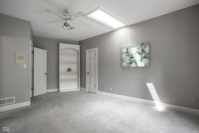 10919 Running Tide Ct, Indianapolis, IN 46236 - unfurnished bedroom featuring carpet flooring, a skylight, baseboards, ceiling fan, and a closet