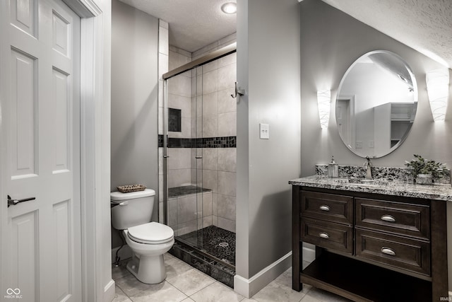 10919 Running Tide Ct, Indianapolis, IN 46236 - bathroom featuring a textured ceiling, vanity, a stall shower, toilet, and baseboards