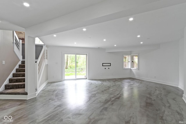 10919 Running Tide Ct, Indianapolis, IN 46236 - unfurnished living room with healthy amount of natural light, stairway, recessed lighting, and baseboards