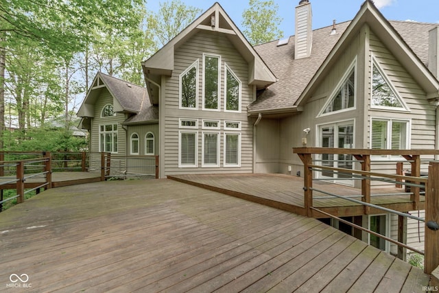 10919 Running Tide Ct, Indianapolis, IN 46236 - rear view of property with a shingled roof, a chimney, and a wooden deck