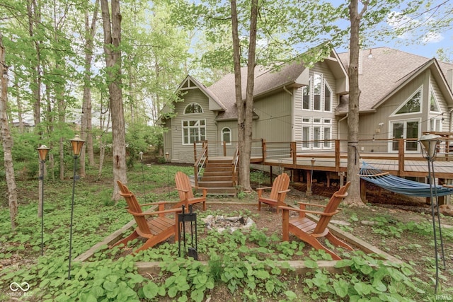10919 Running Tide Ct, Indianapolis, IN 46236 - rear view of house with an outdoor fire pit, roof with shingles, a deck, and stairway