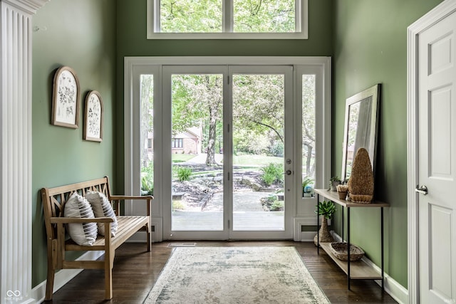 10919 Running Tide Ct, Indianapolis, IN 46236 - doorway to outside featuring dark wood-style floors and baseboards