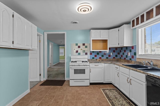 2545 N Bell St, Kokomo, IN 46901 - kitchen featuring white gas stove, a sink, black dishwasher, and white cabinetry