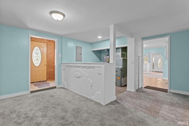 2545 N Bell St, Kokomo, IN 46901 - carpeted entrance foyer with electric panel, baseboards, and arched walkways