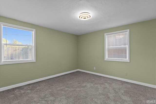 2545 N Bell St, Kokomo, IN 46901 - carpeted spare room featuring baseboards