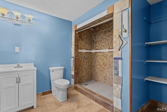 2545 N Bell St, Kokomo, IN 46901 - bathroom featuring toilet, tiled shower, vanity, baseboards, and tile patterned floors