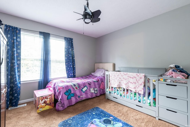 687 N Deer Lake Dr, Bloomfield, IN 47424 - bedroom featuring carpet, multiple windows, and a ceiling fan