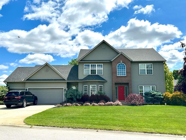 53088 Prestwick Ct, Granger, IN 46530 - colonial house with an attached garage, a front lawn, driveway, and a shingled roof