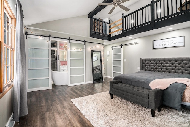 23337 Shorelane, Elkhart, IN 46514 - bedroom with a barn door, wood finished floors, high vaulted ceiling, and baseboards