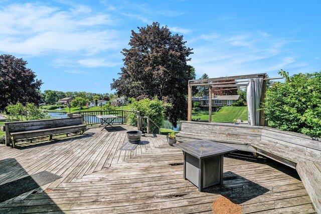 23337 Shorelane, Elkhart, IN 46514 - wooden deck featuring a fire pit