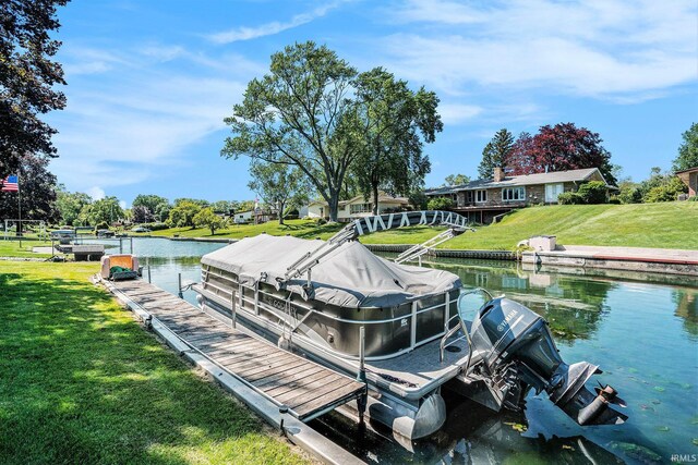 23337 Shorelane, Elkhart, IN 46514 - dock with a water view, boat lift, and a lawn