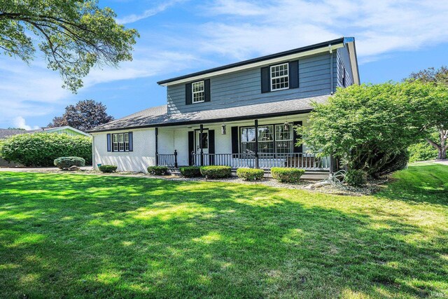 23337 Shorelane, Elkhart, IN 46514 - view of front of house with a porch and a front yard