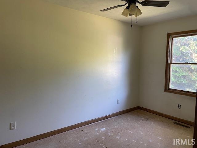 56862 Pomona St, Elkhart, IN 46516 - empty room with baseboards, plenty of natural light, and ceiling fan