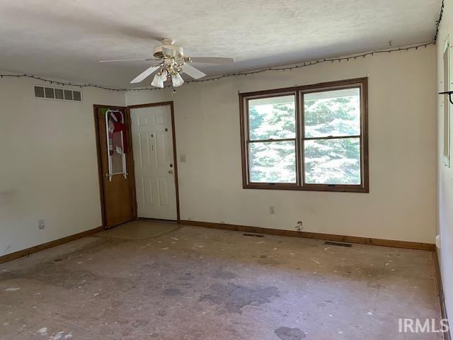 56862 Pomona St, Elkhart, IN 46516 - empty room featuring baseboards and ceiling fan